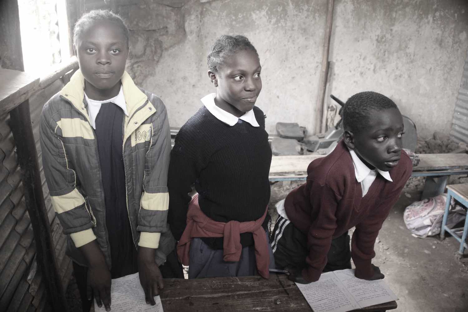 Pupils in school in Korogocho slum of Nairobi, Kenya © Tom Rübenach