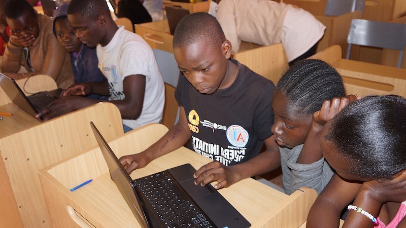 Slum children learning computer literacy at Ayiera Initiative Centre