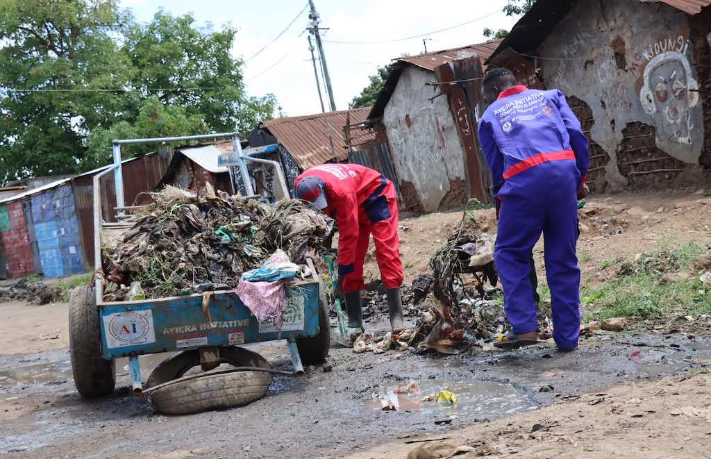 Slum youths in  community cleanup