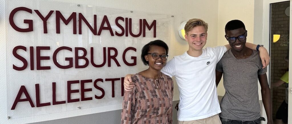 Tabitha (far left), Derrick(far right) and one of the students at GSA