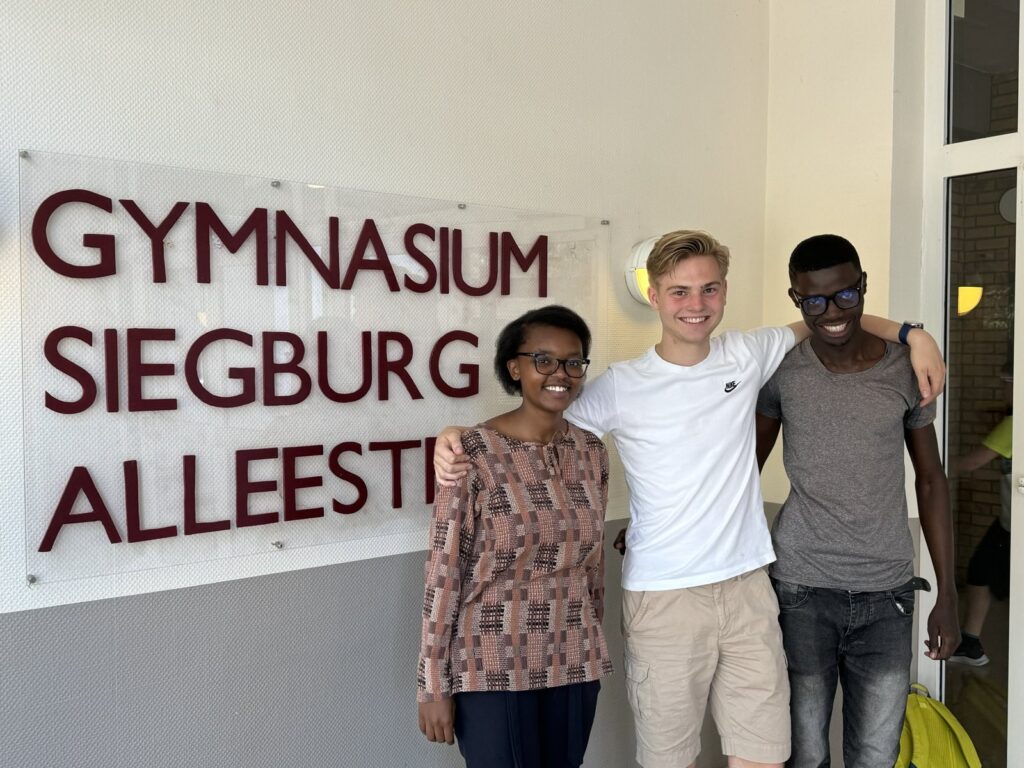 Tabitha (far left), Derrick(far right) and one of the students at GSA