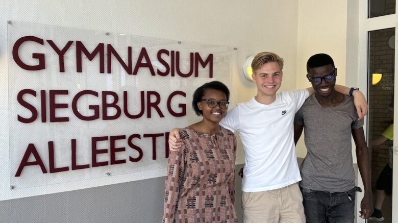 Tabitha (far left), Derrick(far right) and one of the students at GSA